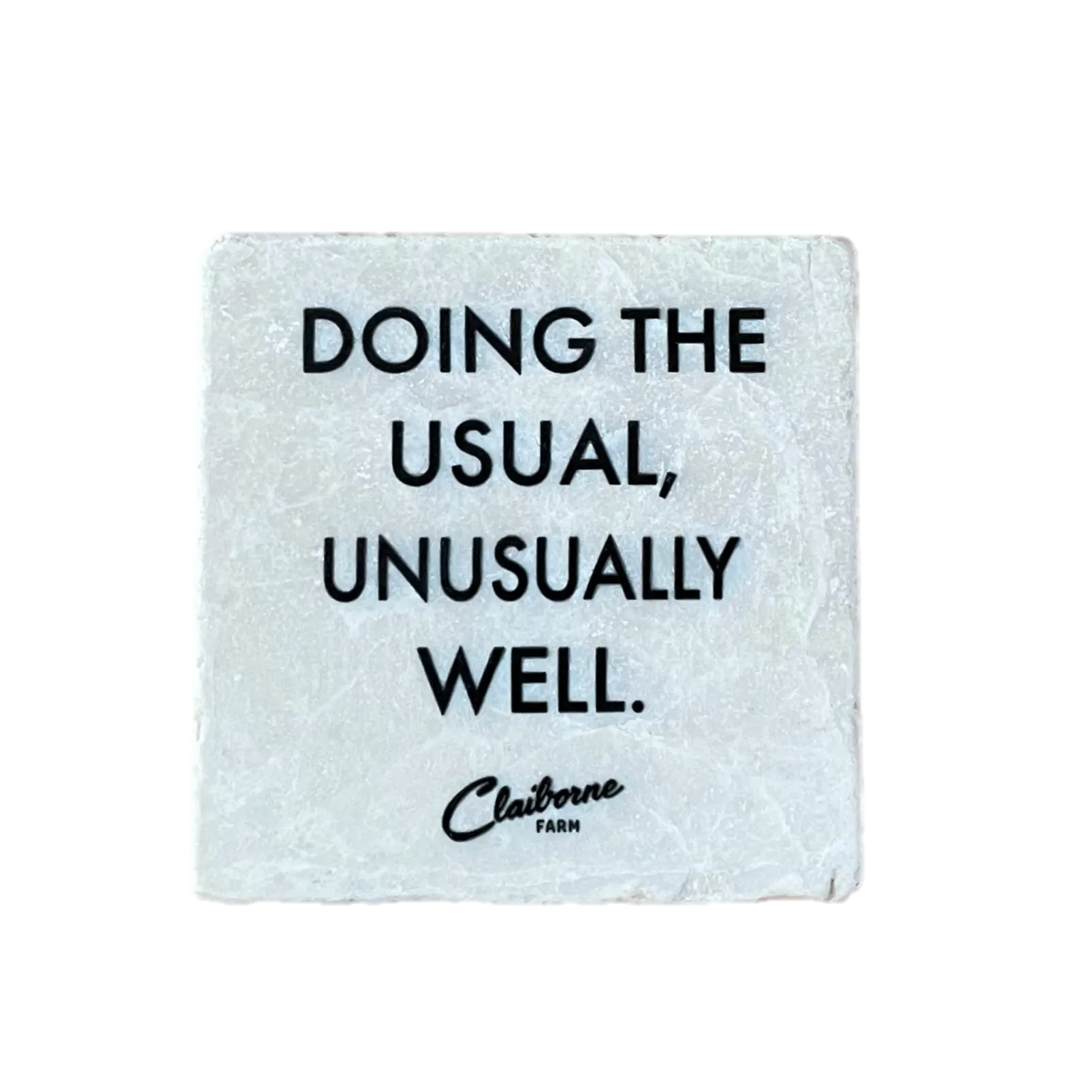 "Doing the Usual, Unusually Well" Motto Marble Coaster